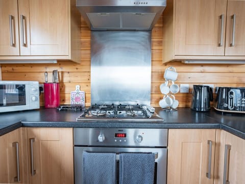 Cabinetry, Property, Countertop, Kitchen Appliance, White, Building, Kitchen Stove, Kitchen, Blue, Home Appliance