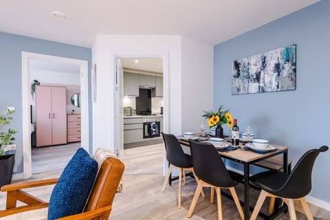 The open-plan living room and dining area benefit from a 50-inch Smart TV, a 6-seater dining table, plenty of space to sit down in the evenings, a double sofa bed and a sizable balcony.