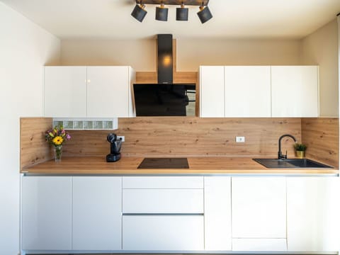 Kitchen, Countertop, Kitchen Appliance, Cabinetry, Interior Design, Furniture, Flooring, Major Appliance, Wood, Home Appliance