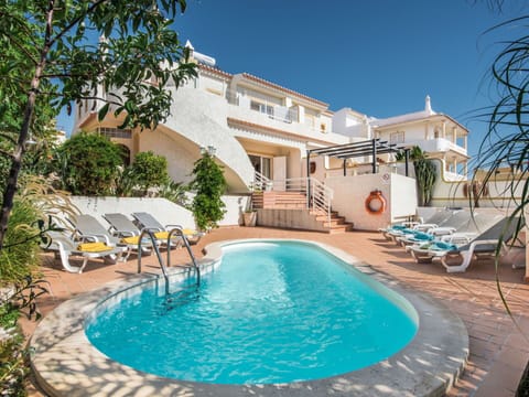 Water, Sky, Property, Swimming Pool, Azure, Cloud, Seaside Resort, Outdoor Furniture, Plant, Tree