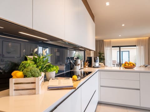 Kitchen, Interior Design, Countertop, Kitchen Appliance, Cabinetry, Flooring, Light Fixture, Furniture, Ceiling, Lighting