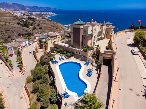 Water, Building, Property, Sky, Azure, Seaside Resort, Tree, Body Of Water, Swimming Pool, Architecture