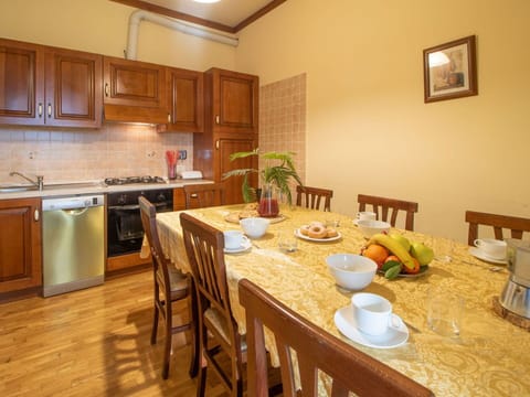 Table, Cabinetry, Property, Furniture, Countertop, Picture Frame, Wood, Chair, Tableware, Interior Design