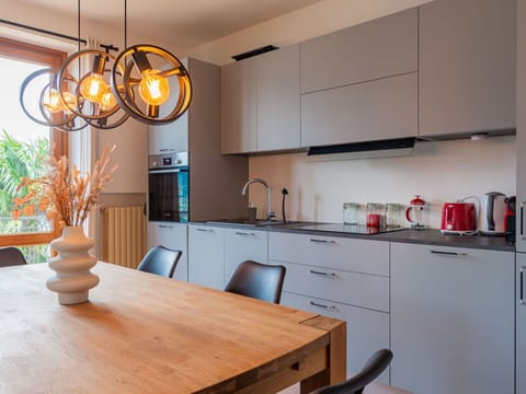 Cabinetry, Furniture, Table, Property, Countertop, Wood, Lighting, Plant, Interior Design, Drawer