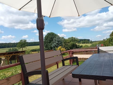 Sky, Property, Plant, Cloud, Shade, Umbrella, Wood, Outdoor Furniture, Tree, Leisure