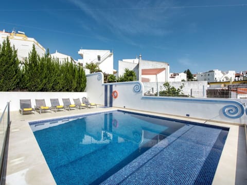 Water, Sky, Swimming Pool, Property, Tree, Outdoor Furniture, Aqua, Leisure, Umbrella