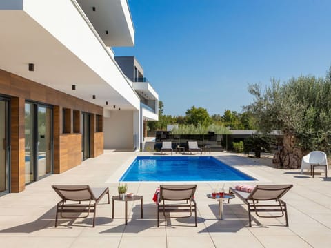 Sky, Furniture, Plant, Swimming Pool, Azure, Building, Tree, Chair, Shade, Architecture