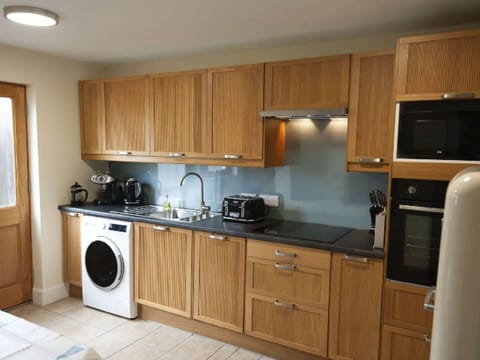 Brown, Cabinetry, Countertop, Property, Sink, Kitchen Appliance, Laundry Room, Kitchen Stove, Kitchen, Wood