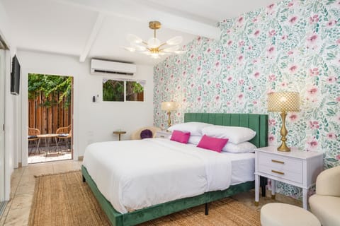 Step into a colorful Palm Springs retreat with floral charm and peaceful outdoor vibes.
