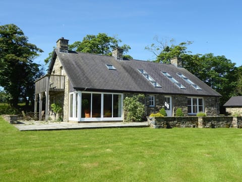 The outside of Bryn Isaf with grass in the front