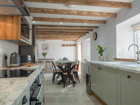 Kitchen cabinets view down to the dining table and chairs