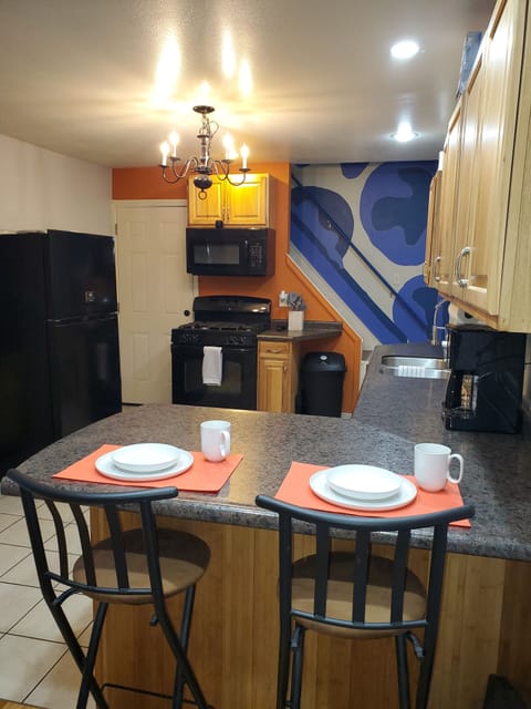 View of kitchen with garage and patio area access.