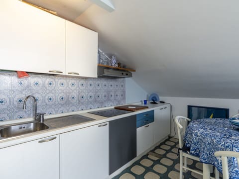 Cabinetry, Property, Kitchen Sink, Sink, Countertop, Tap, Blue, Interior Design, Flooring, Floor