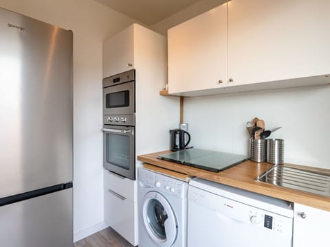 Cabinetry, Property, Countertop, Kitchen Appliance, Kitchen Stove, Kitchen, Home Appliance, Laundry Room, Kitchen Sink, Lighting