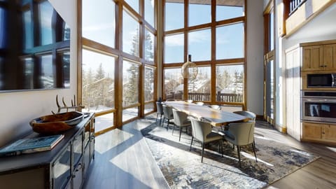 A dining area with a wood dining table and chairs.