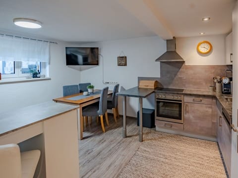 Furniture, Interior Design, Wood, Flooring, Ceiling, Floor, Room, Countertop, Lighting, Kitchen