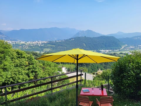 Sky, Plant, Property, Mountain, Ecoregion, Umbrella, Natural Landscape, Shade, Outdoor Furniture, Tree