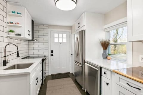 5 burner oven/range, full refrigerator and freezer, dishwasher, small microwave.