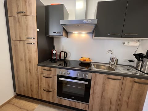 Cabinetry, Kitchen Sink, Countertop, Sink, Tap, Property, Kitchen Stove, Plumbing Fixture, Kitchen, Wood