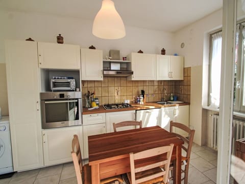 Furniture, Kitchen, Kitchen Appliance, Countertop, Flooring, Major Appliance, Interior Design, Wood, Cabinetry, Floor