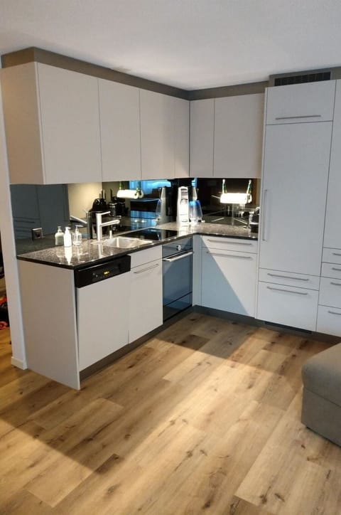 Cabinetry, Countertop, Building, Kitchen, Wood, Chair, Kitchen Appliance, Flooring, Floor, Kitchen Stove