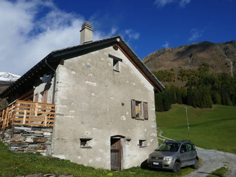 Cloud, Sky, Plant, Car, Building, Window, Vehicle, Mountain, Land Lot, House