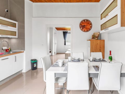 Furniture, Building, Cabinetry, Table, Interior Design, Lighting, Kitchen, Architecture, Countertop, Floor