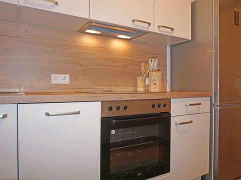 Cabinetry, Countertop, Building, Drawer, Wood, Kitchen Stove, Kitchen, Kitchen Appliance, Flooring, Interior Design