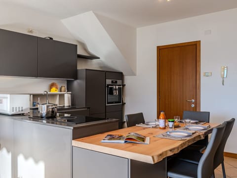 Cabinetry, Property, Furniture, Table, Countertop, Wood, Orange, Kitchen, Kitchen Stove, Interior Design