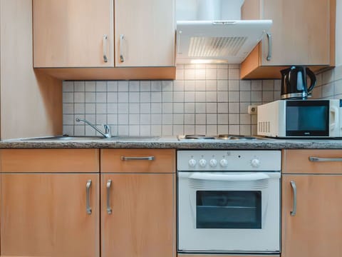 Cabinetry, Countertop, Property, Kitchen Sink, Kitchen Stove, Kitchen, Kitchen Appliance, Wood, Tap, Sink