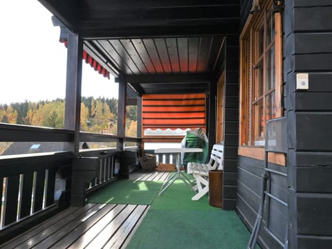 Wood, Porch, Grass, Building, Sky, Tree, Shade, Hardwood, Roof, Leisure