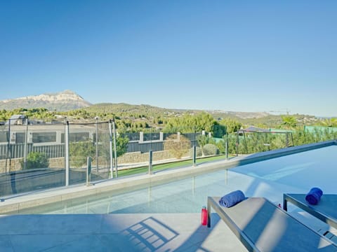 Sky, Plant, Blue, Shade, Outdoor Furniture, Fence, Swimming Pool, Urban Design, Building, Tree