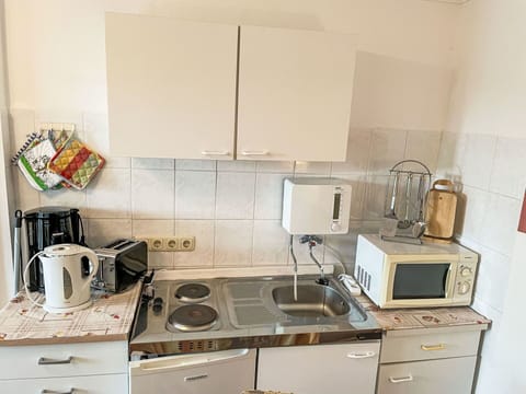 Cabinetry, Countertop, Gas Stove, Kitchen Appliance, Kitchen Stove, Cooktop, Kitchen, Home Appliance, Interior Design, Drawer