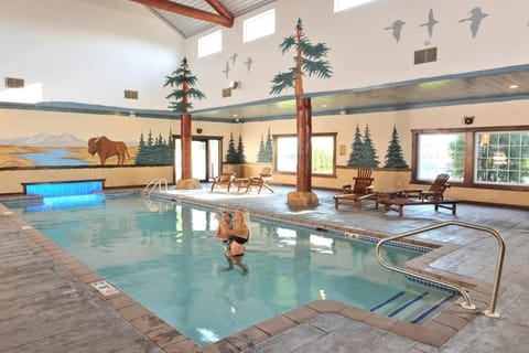 Dive into a bright indoor pool with rustic charm.