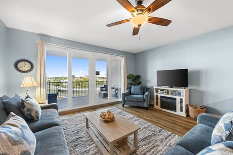 Cozy Living Room with Lake Views, New Flooring, Sleeper Sofa, Flat Screen TV and Private Balcony Access