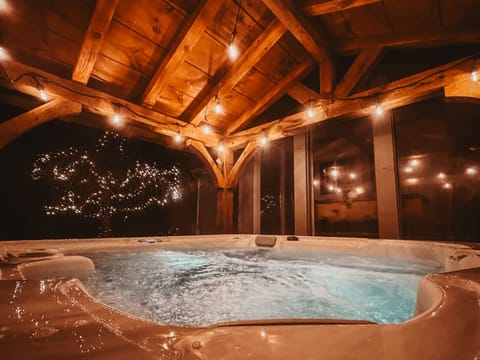 Covered hot tub on the back patio