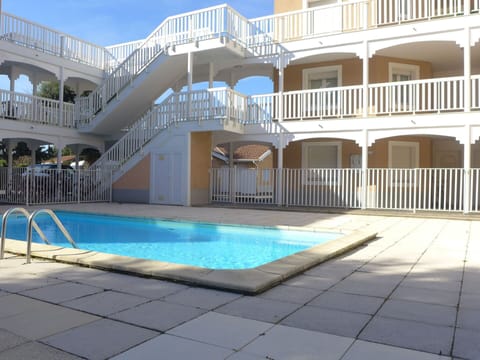 Water, Azure, Window, Sky, Building, Swimming Pool, Shade, Condominium, Real Estate, Composite Material