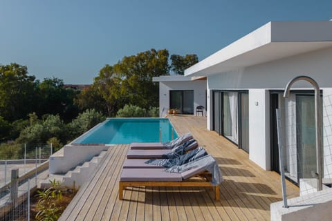 Private pool and sunbeds overlooking Paleros bay 
