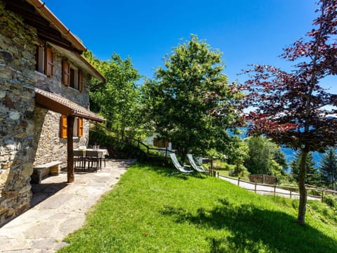 Plant, Property, Window, Building, Flower, Sky, Chair, Outdoor Furniture, Land Lot, Cottage