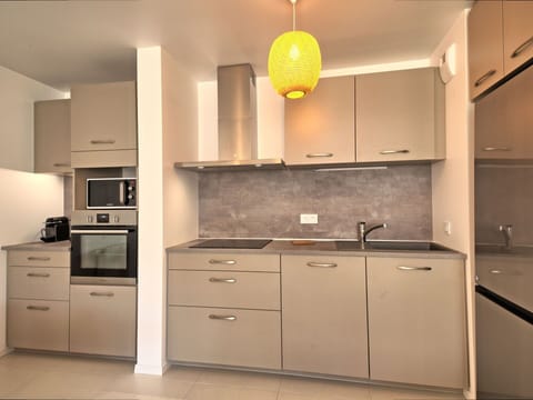 Cabinetry, Furniture, Property, Building, Countertop, Kitchen, Wood, Drawer, Lighting, Kitchen Stove