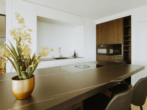 Furniture, Plant, Property, Cabinetry, Table, Countertop, Flowerpot, Wood, Architecture, Interior Design