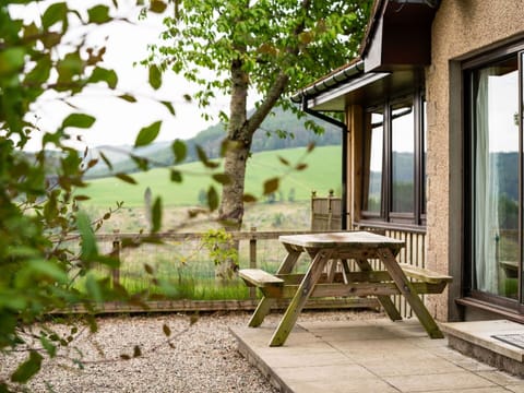 Building, Plant, Table, Window, Shade, Wood, Tree, Outdoor Furniture, Natural Landscape, House