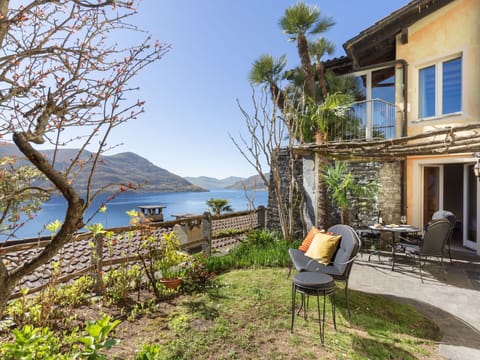 Sky, Plant, Building, Property, Water, Window, Furniture, Chair, House, Wood