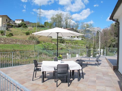 Plant, Cloud, Sky, Furniture, Property, Table, Building, Umbrella, Shade, Outdoor Furniture