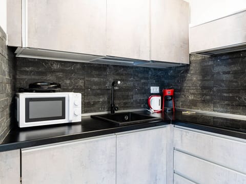 Kitchen, Countertop, Kitchen Appliance, Major Appliance, Flooring, Home Appliance, Cabinetry, Interior Design, Floor, Sink