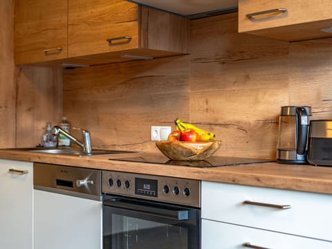 Countertop, Kitchen, Cabinetry, Kitchen Appliance, Flooring, Furniture, Major Appliance, Home Appliance, Drawer, Wood Stain