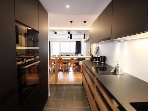 Cabinetry, Countertop, Furniture, Kitchen, Kitchen Appliance, Home Appliance, Wood, Lighting, Interior Design, Kitchen Stove