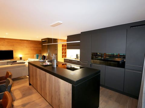 Countertop, Cabinetry, Furniture, Building, Kitchen Appliance, Kitchen Stove, Kitchen, Home Appliance, Lighting, Chair