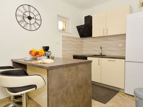 Property, Cabinetry, Building, Interior Design, Kitchen Sink, Countertop, Kitchen Stove, Flooring, Table, Floor