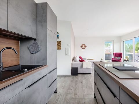 Countertop, Cabinetry, Tap, Sink, Building, Kitchen, Window, Wood, Plumbing Fixture, Houseplant